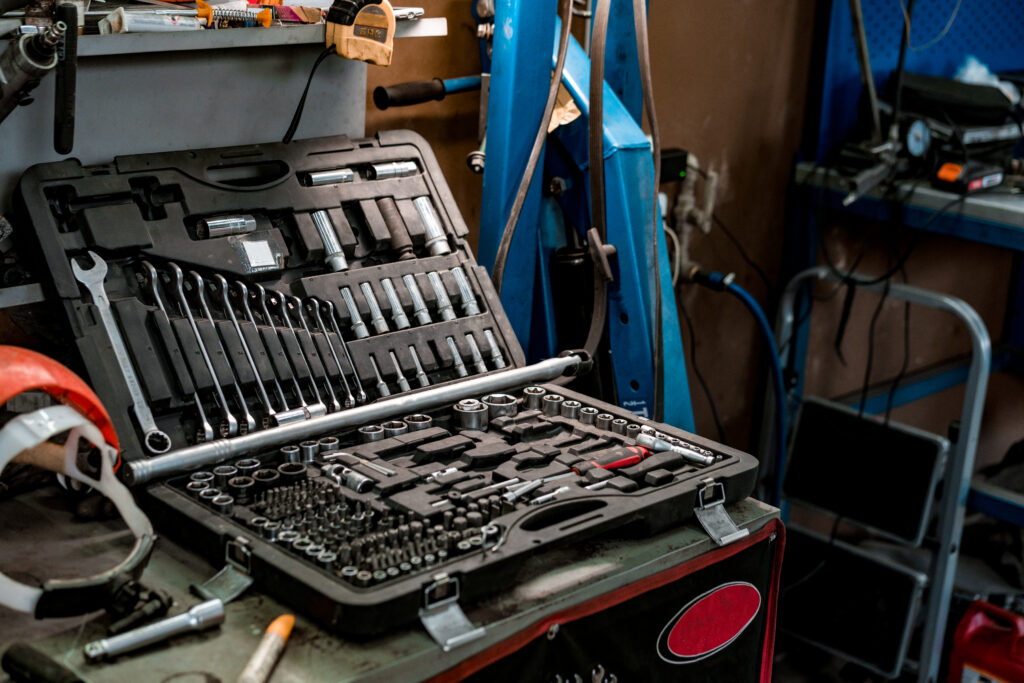 large workbench with tools at station for vehicle technical servicing