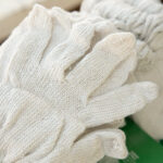 close up and selective focus shot of white fabric glove in new p