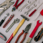 set of hand tools on a stone gray panel close up